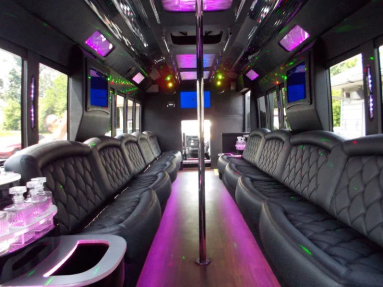 Ford limo Party bus interior with pink lights, seatings and bar