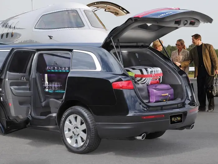 On Time Limousine service showcasing MKT Limousine with trunk open at airport