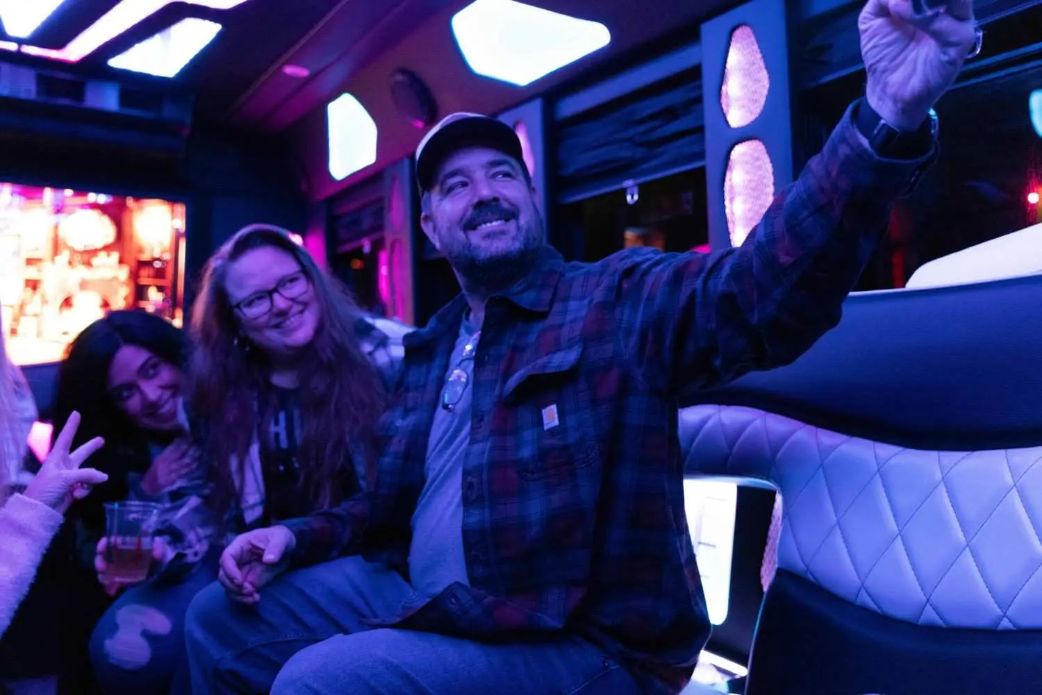 Home Vancouver City Tours showcasing three folks in party bus