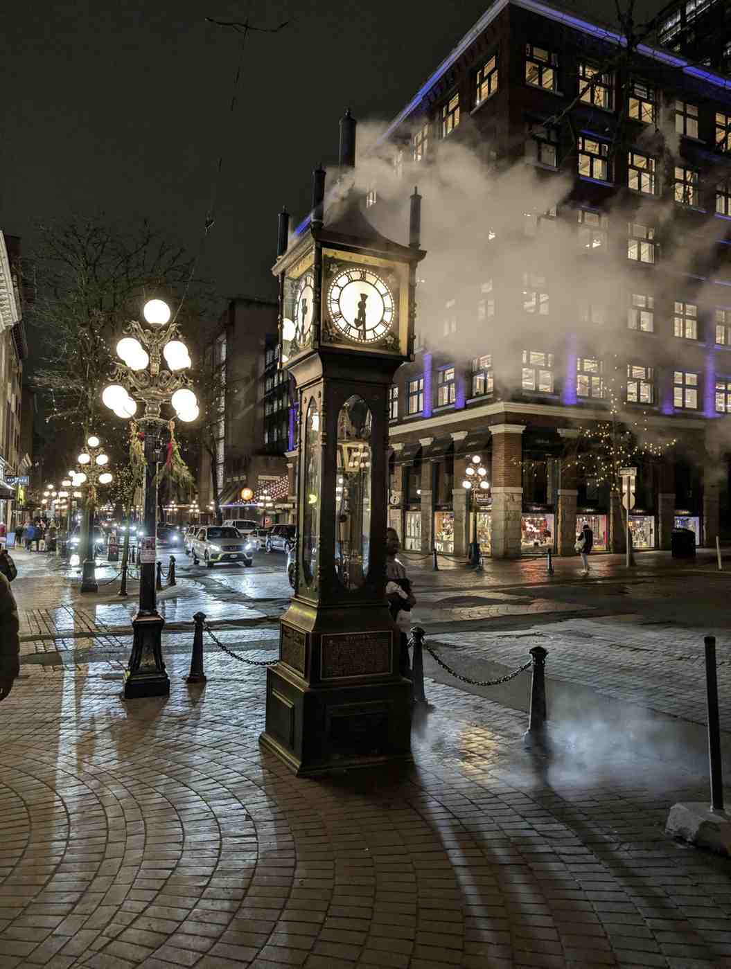 a clock tower with a steam coming out of it