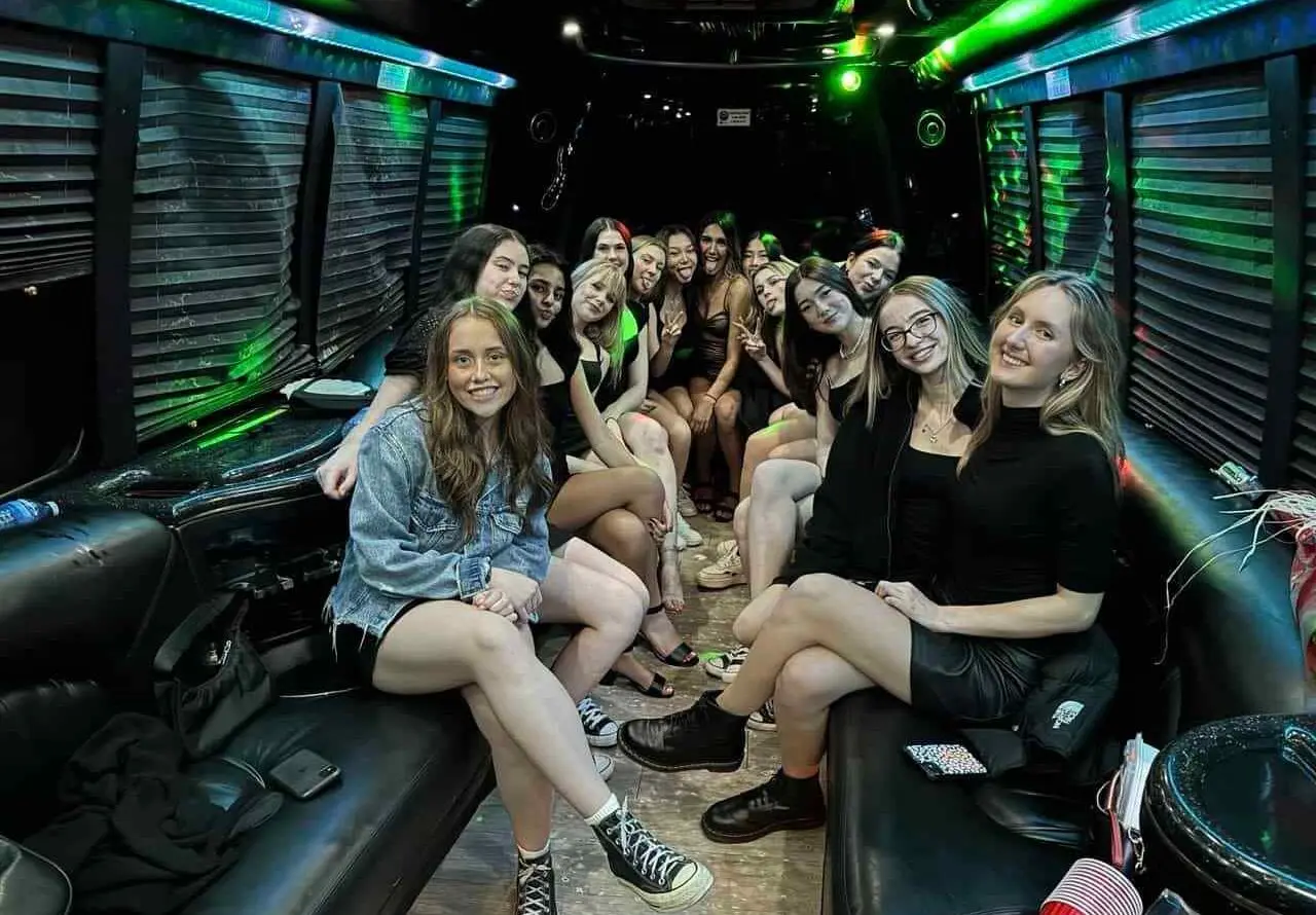 Home Vancouver Party Bus Rental showcasing girls sitting in the party bus